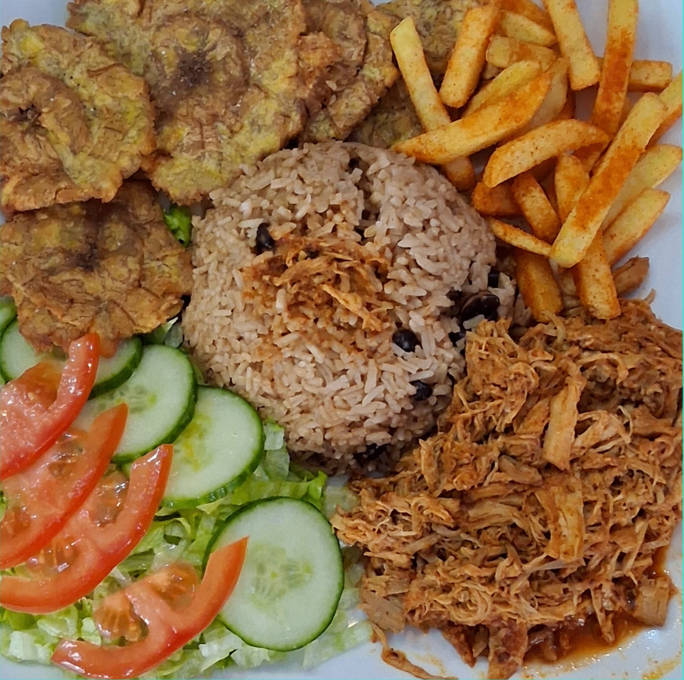 Traditional Cuban plate with black beans and fried plantain