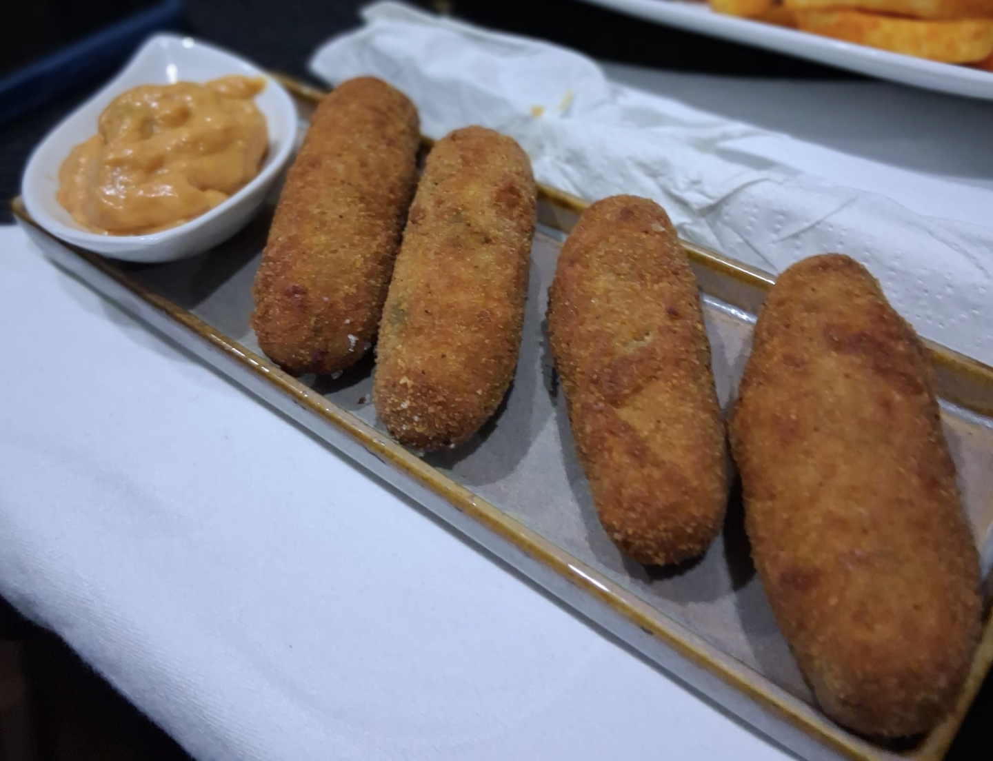 Croquetas served with dipping sauce